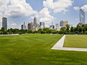 Uptown Charlotte Skyline by Carolina Panthers Practice Field