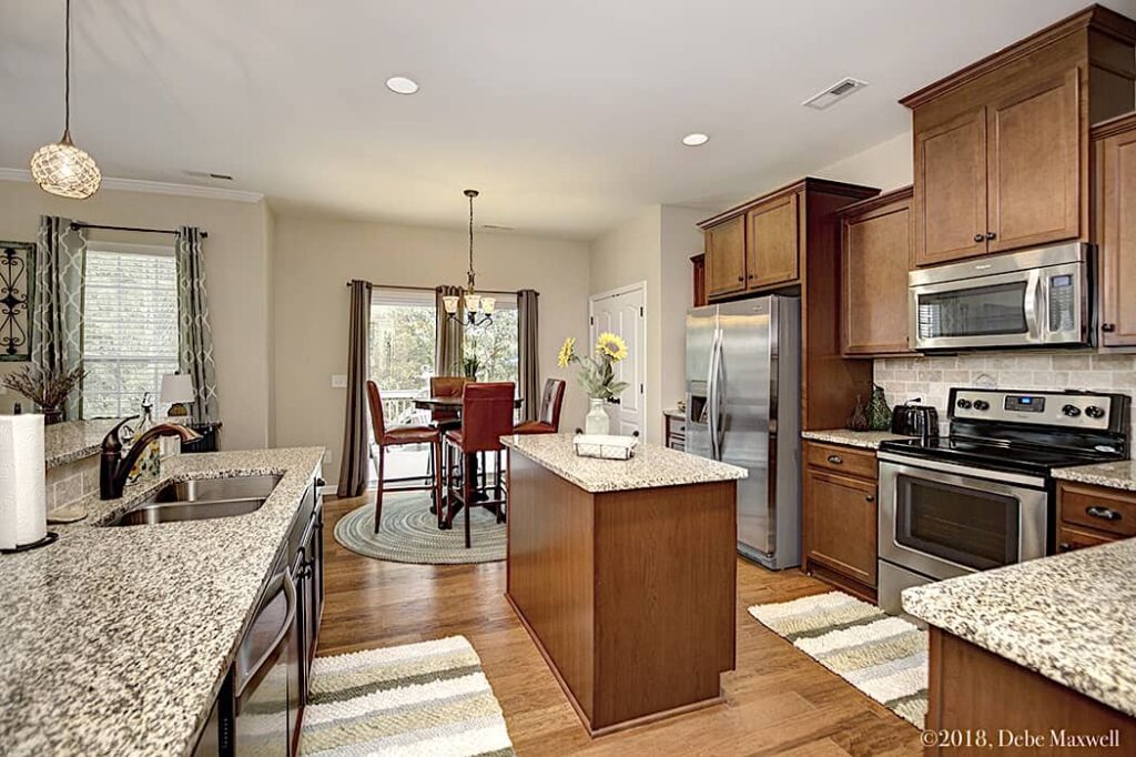 Lovely eat-in kitchen with lots of windows, open floorplan and plenty of sunshine!