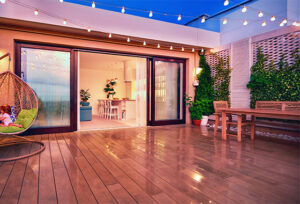 cozy rooftop patio with sliding doors at the evening after the rain